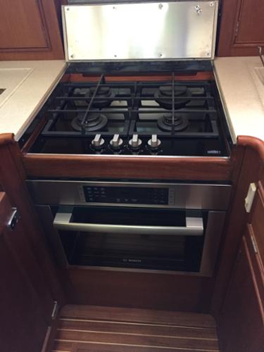 We installed this propane cook top and convection/microwave oven to replace the original electric cooktop on a lovely Grand Banks yacht. 
