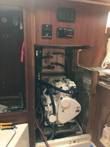 This was a tight fit! We had to replace the water heater mounted over the generator with a more compact model to get everything in this compartment. We made the panel above to mount the new generator and other controls (the holes in the old one were too big).